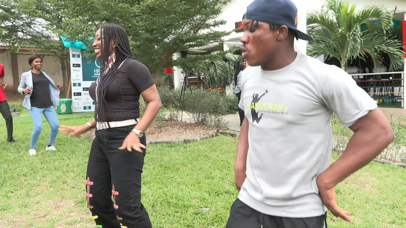 Members dancing on the lawn outside the venue