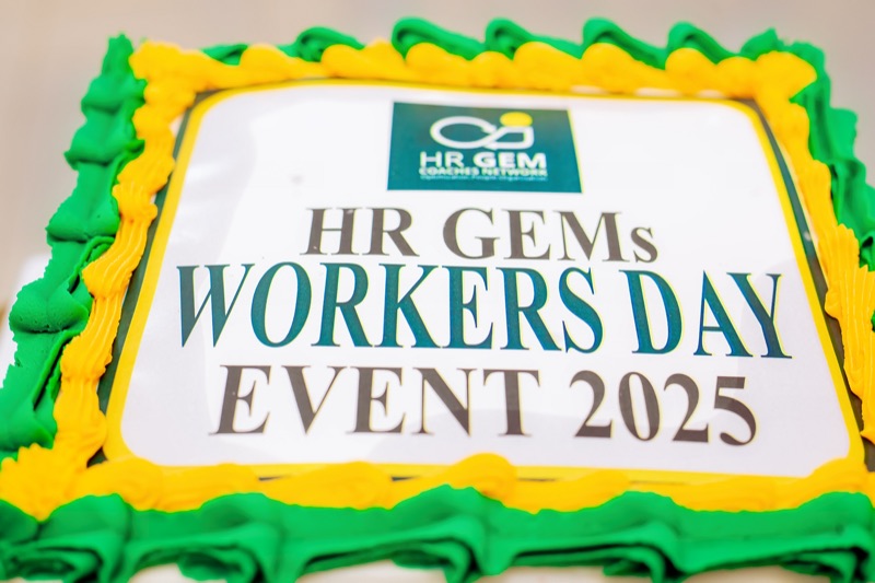 A celebration cake reading "HR GEMs Workers Day Event 2025"