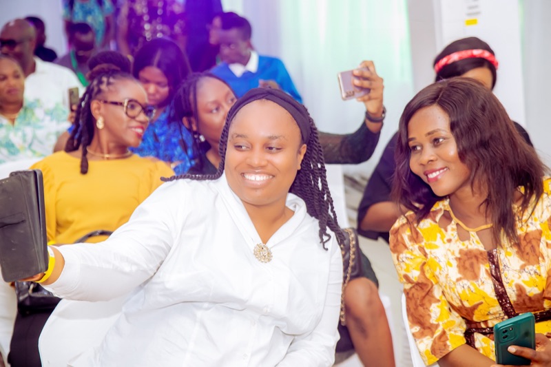 Two smiling attendees taking a selfie