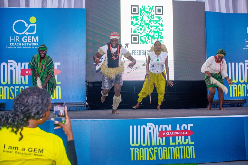 Performers dancing on the Workplace Transformation stage